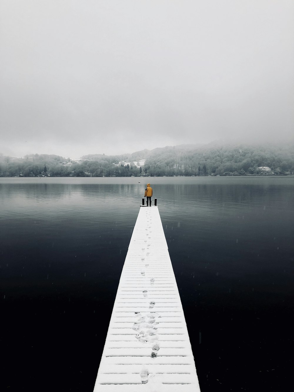 man standing on dock