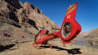 A stunning helicopter flying over the Grand Canyon.
