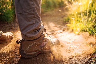 person wearing pair of brown sneakers