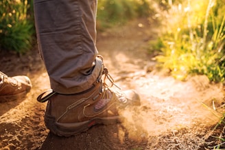 person wearing pair of brown sneakers