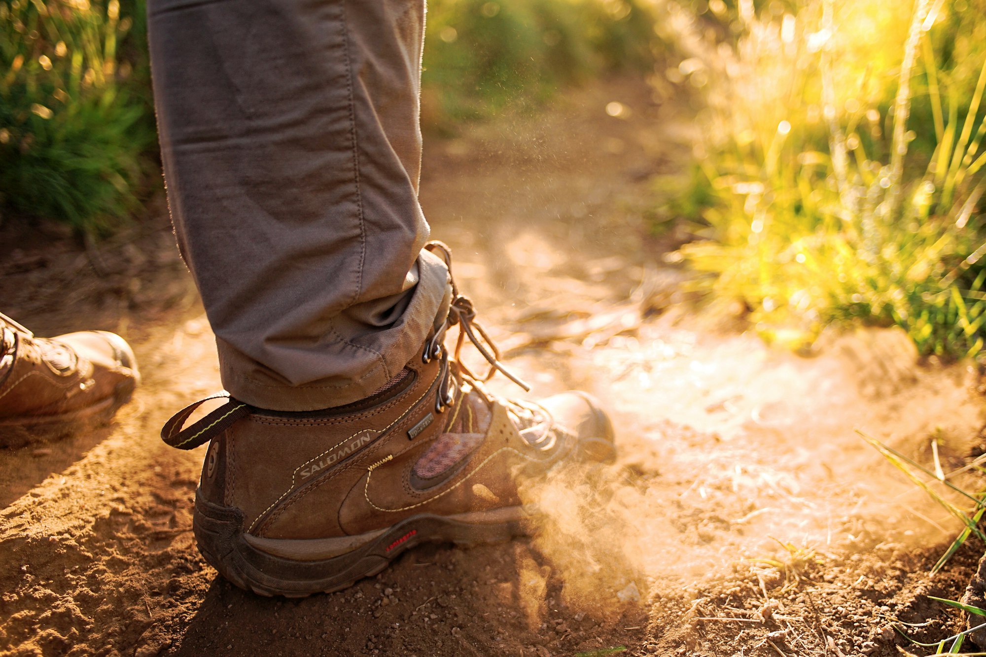 Hiking boots on dusty path 