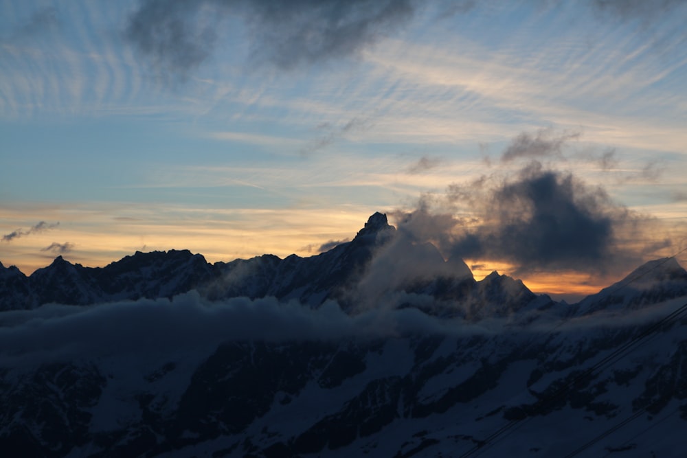 white clouds and mountain over golden hour view