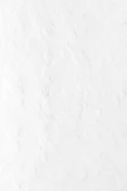 a person riding a snowboard down a snow covered slope