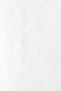 a person riding a snowboard down a snow covered slope