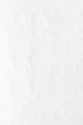 a person riding a snowboard down a snow covered slope