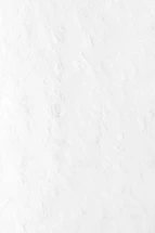a person riding a snowboard down a snow covered slope