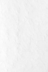 a person riding a snowboard down a snow covered slope
