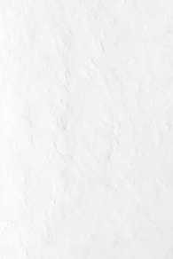 a person riding a snowboard down a snow covered slope
