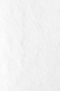 a person riding a snowboard down a snow covered slope