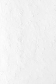 a person riding a snowboard down a snow covered slope