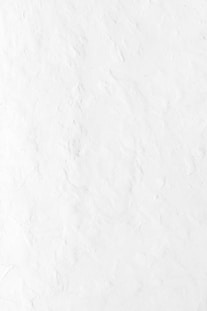 a person riding a snowboard down a snow covered slope