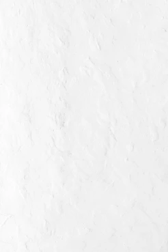 a person riding a snowboard down a snow covered slope