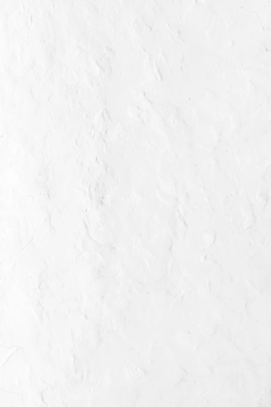 a person riding a snowboard down a snow covered slope