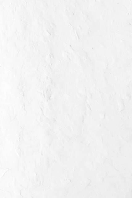a person riding a snowboard down a snow covered slope