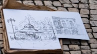 Children sketching the intricate details of a historic London building during an outdoor session.