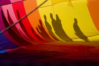 A balloon featuring intricate shadow art that casts a romantic silhouette on the wall.