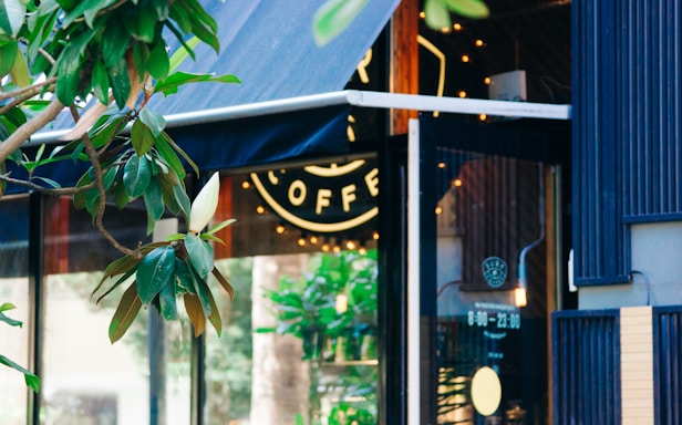 A friendly local shopfront in Spring, Texas, bathed in warm sunlight.