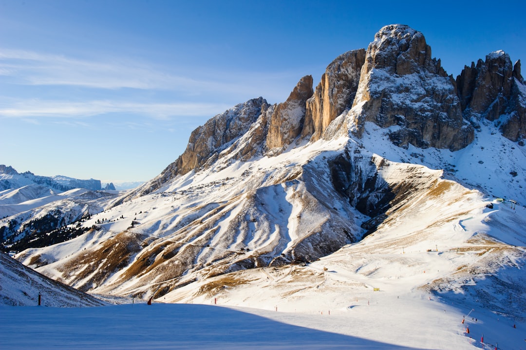 snow covered field and glacier mountains at the distance