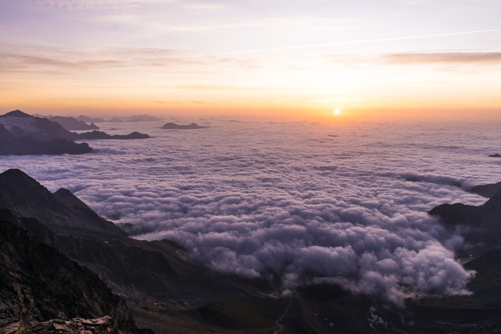 sea of clouds during golden hour