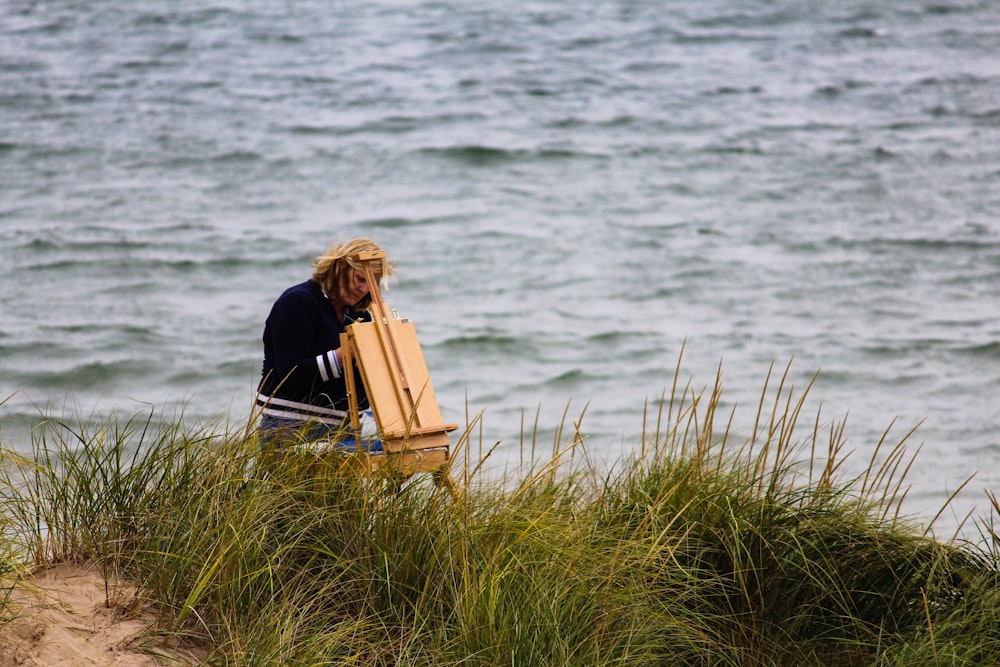 person standing at the back of an easel