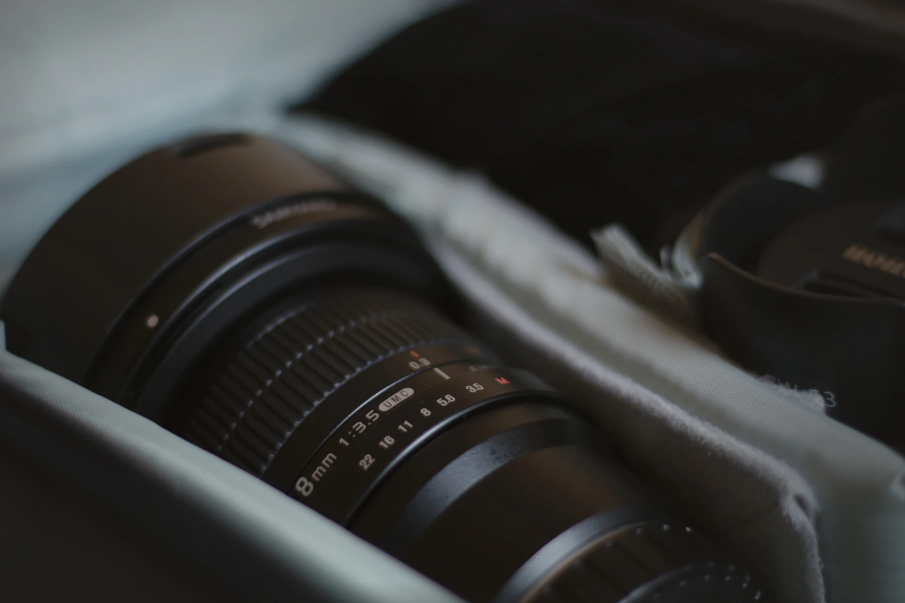 Camera lens close-up in a cinematic professional gear setup