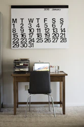 black chair in front of turned on laptop