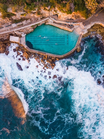 photo of pool near body of water