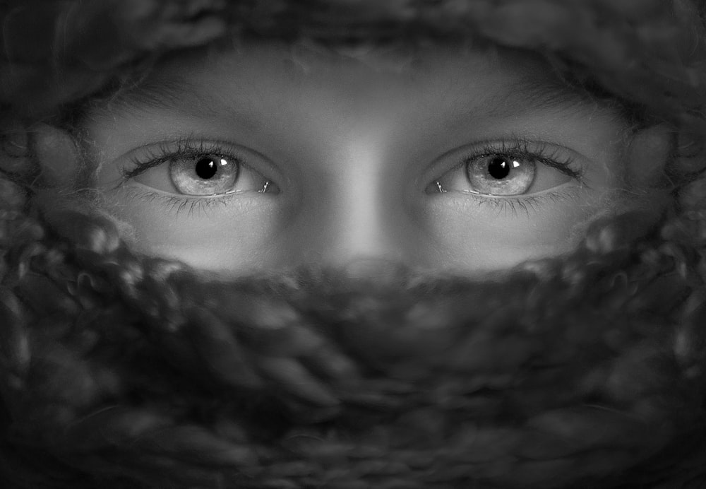 grayscale shot of person's eyes