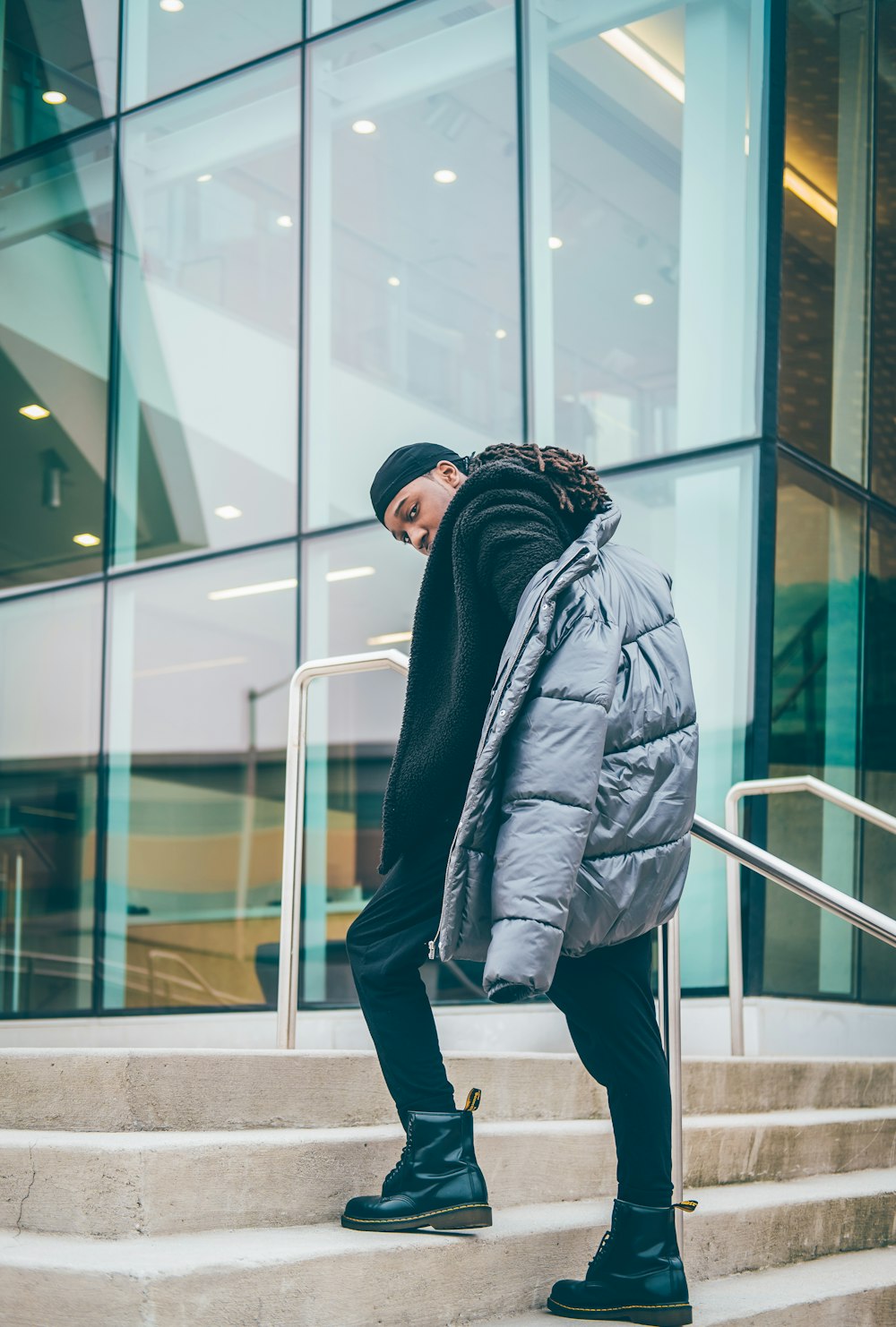 man walking on stairs during daytime