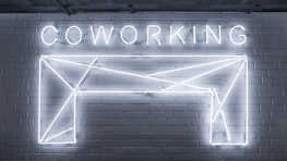 A creative workspace illuminated by modern lighting, with stylish branding elements.