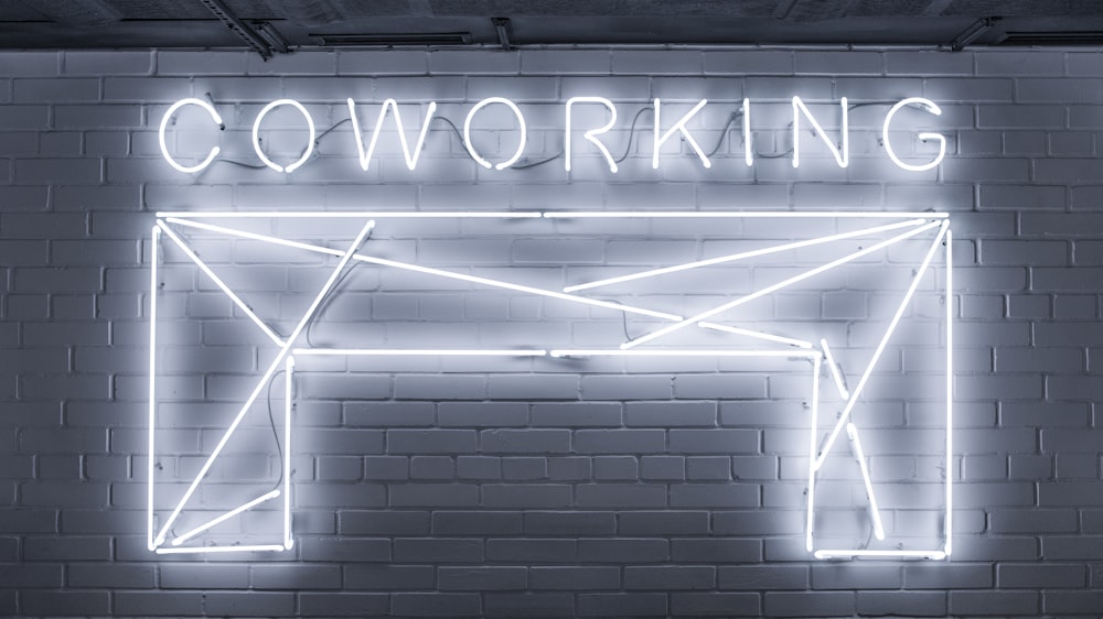 closeup photo of Co Working neon light sign