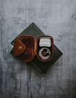 black metered device on black covered book