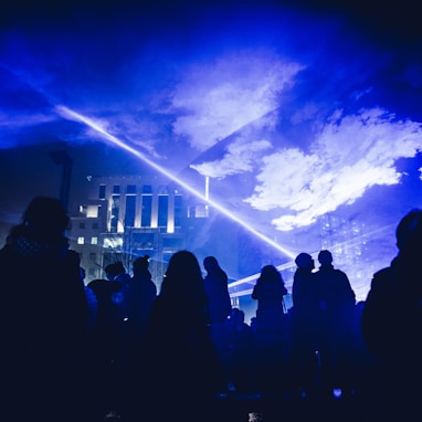 crowd of people under hologram