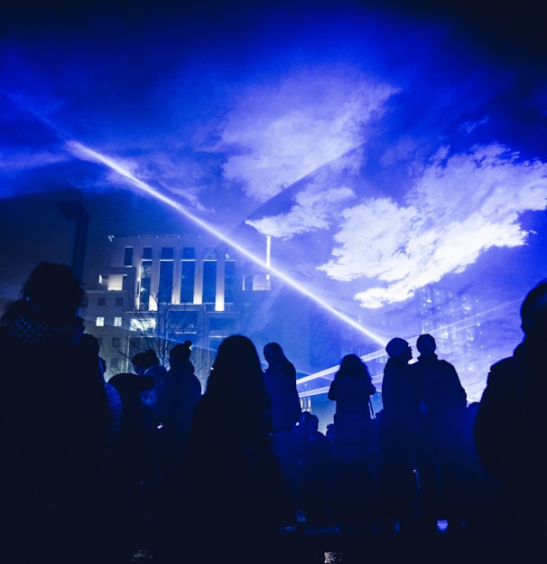 crowd of people under hologram