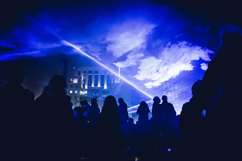 crowd of people under hologram