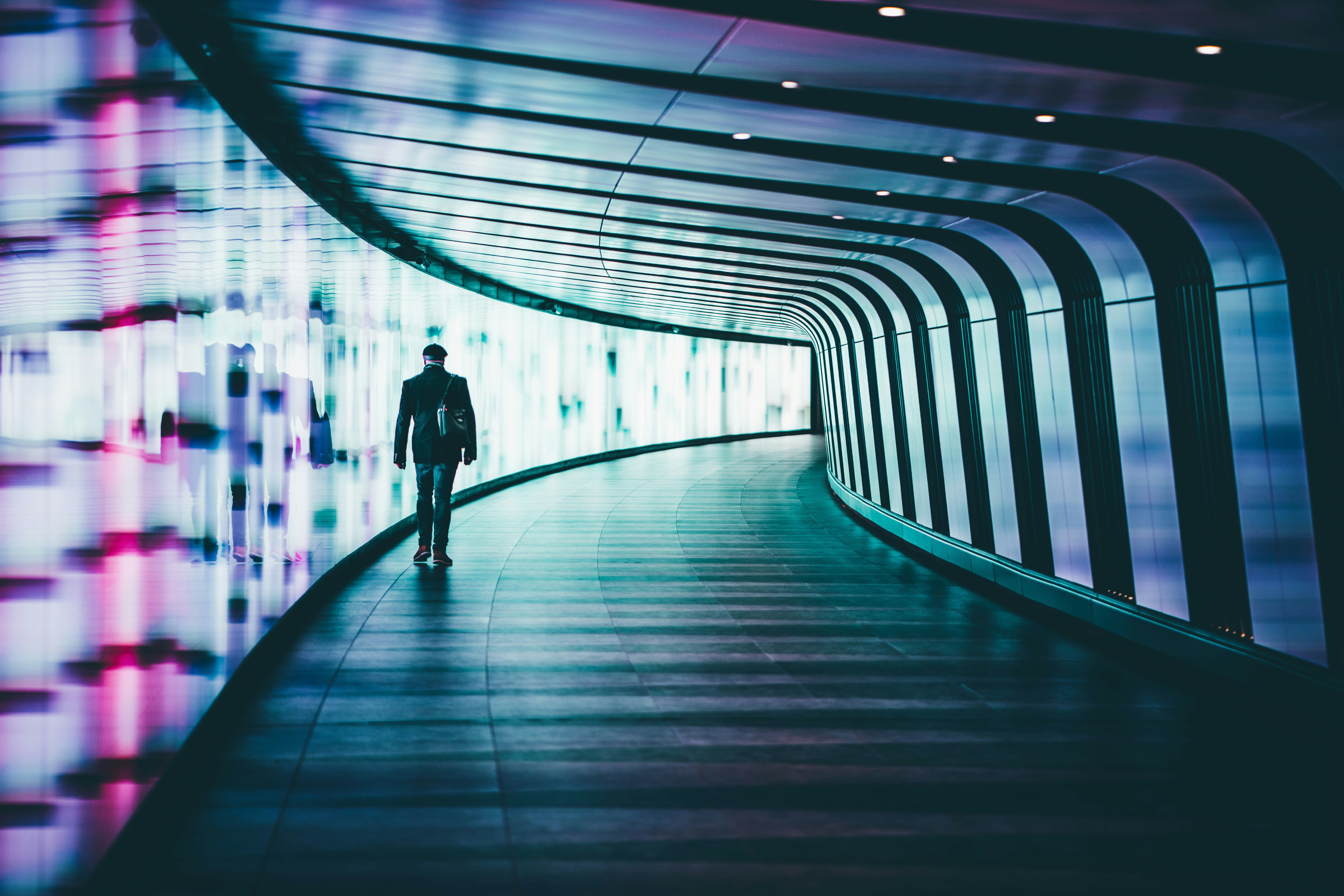 Branimo user walking along modern office corridors