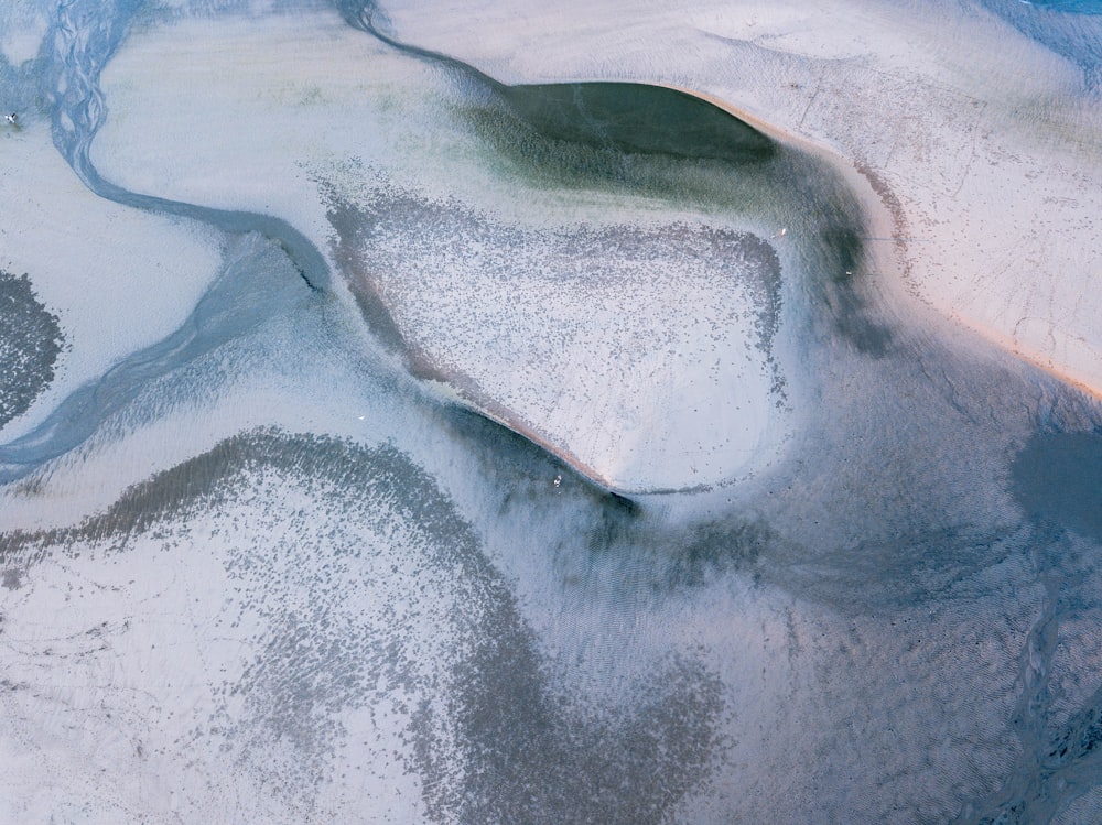 an aerial view of a snow covered landscape