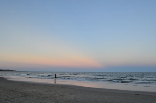 A peaceful bonefishing scene on Andros Island’s crystal-clear flats at golden hour.