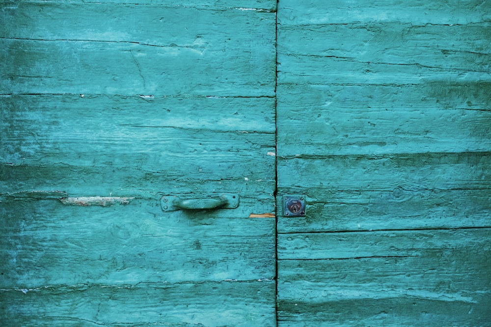 closed teal wooden door