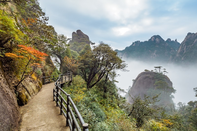 Huashan Mountain dramatic peaks with winding plank walk trail and cable car in summer
