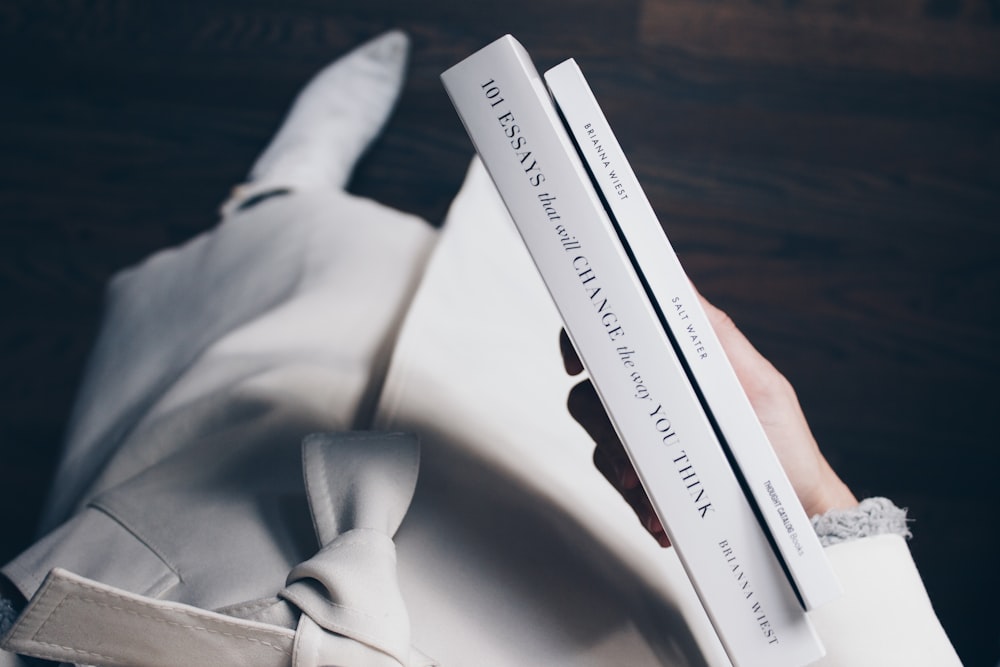 person holding books