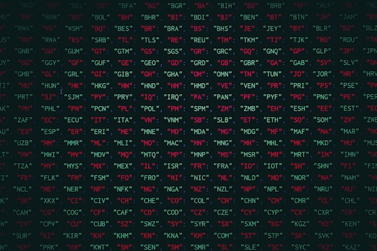 a black background with red and green letters