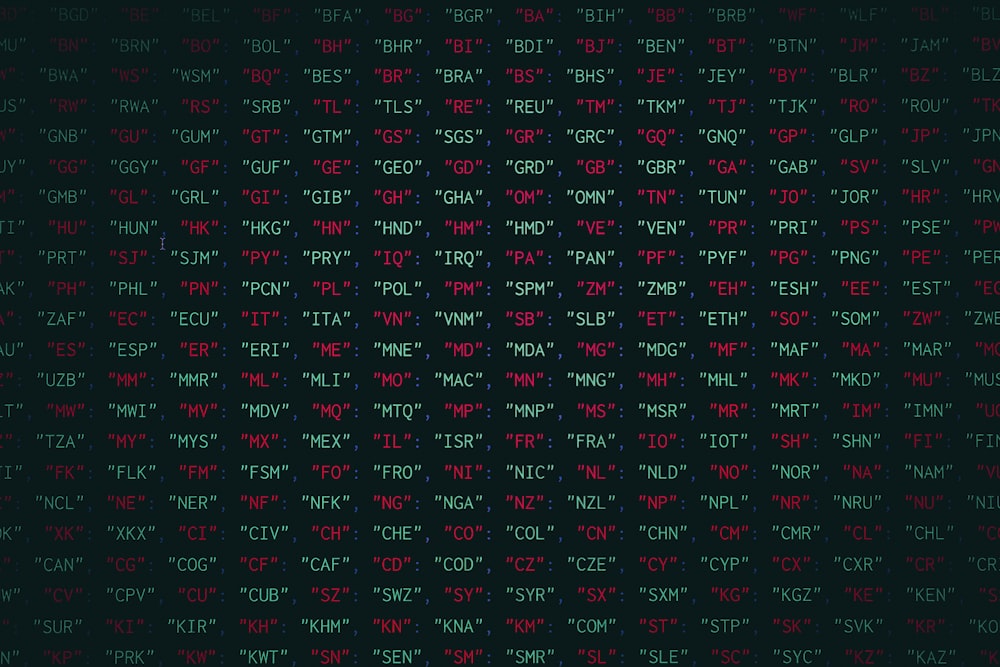 a black background with red and green letters