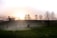 A serene landscape with a sunrise symbolizing new beginnings and hope.