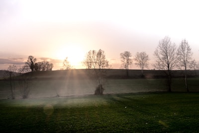 A serene sunrise over a tranquil landscape, symbolizing new beginnings.