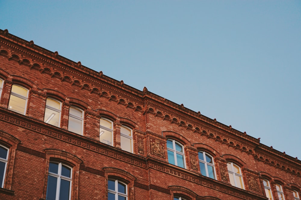 low angle photography of brown building