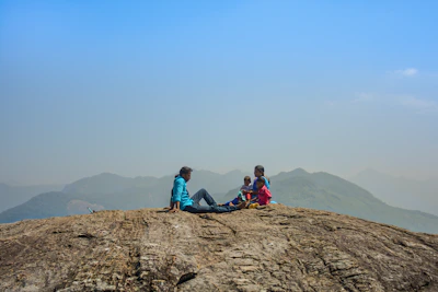 Family enjoying a peaceful afternoon on the terrace overlooking the rocky outcrop.