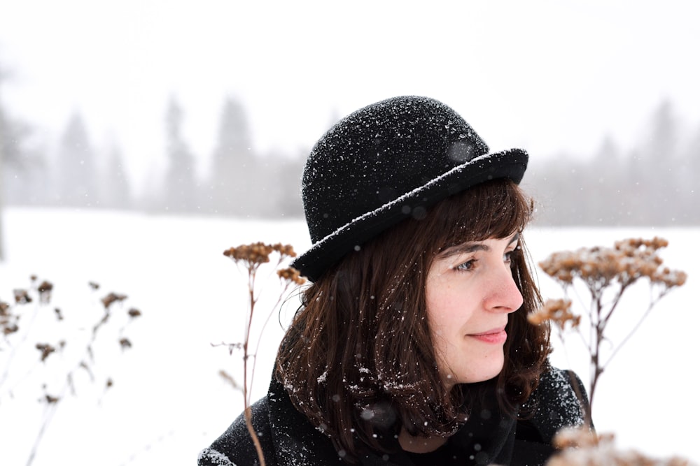 woman wearing black cap