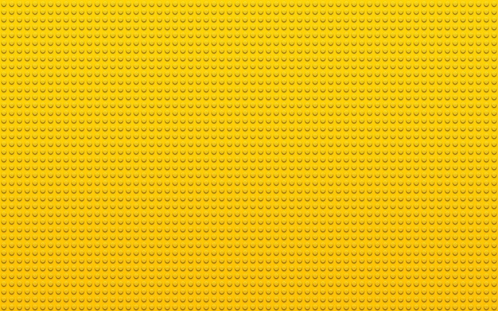 a yellow background with small dots