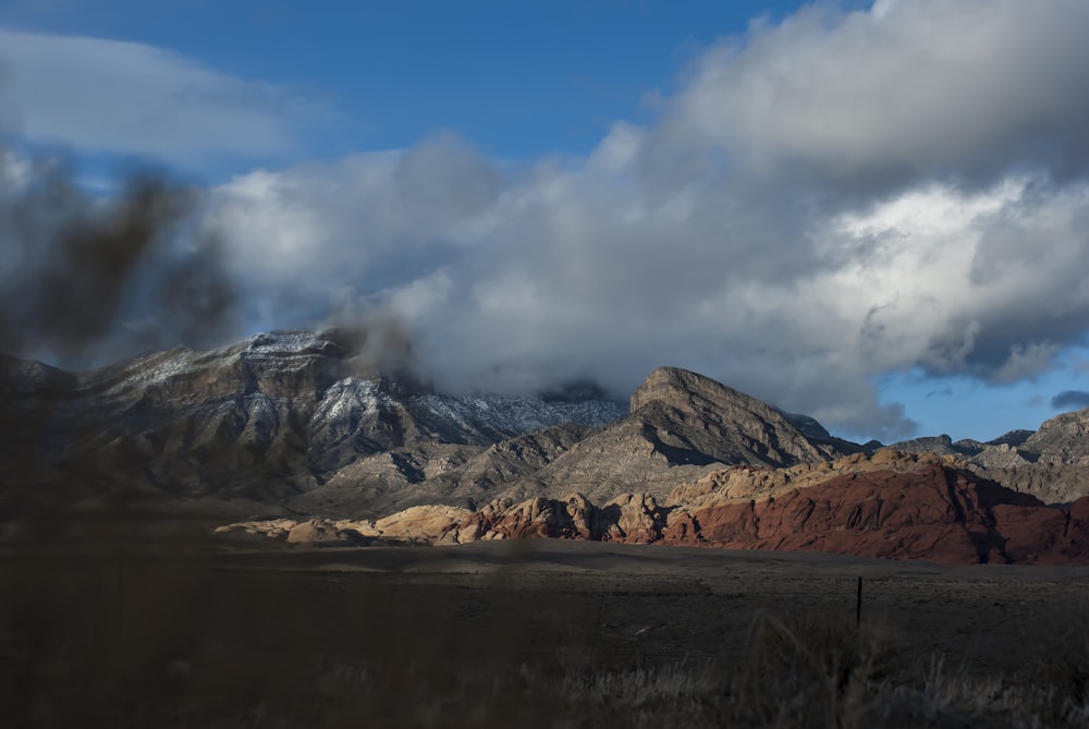 landscape photography of grey mountains under white clouds